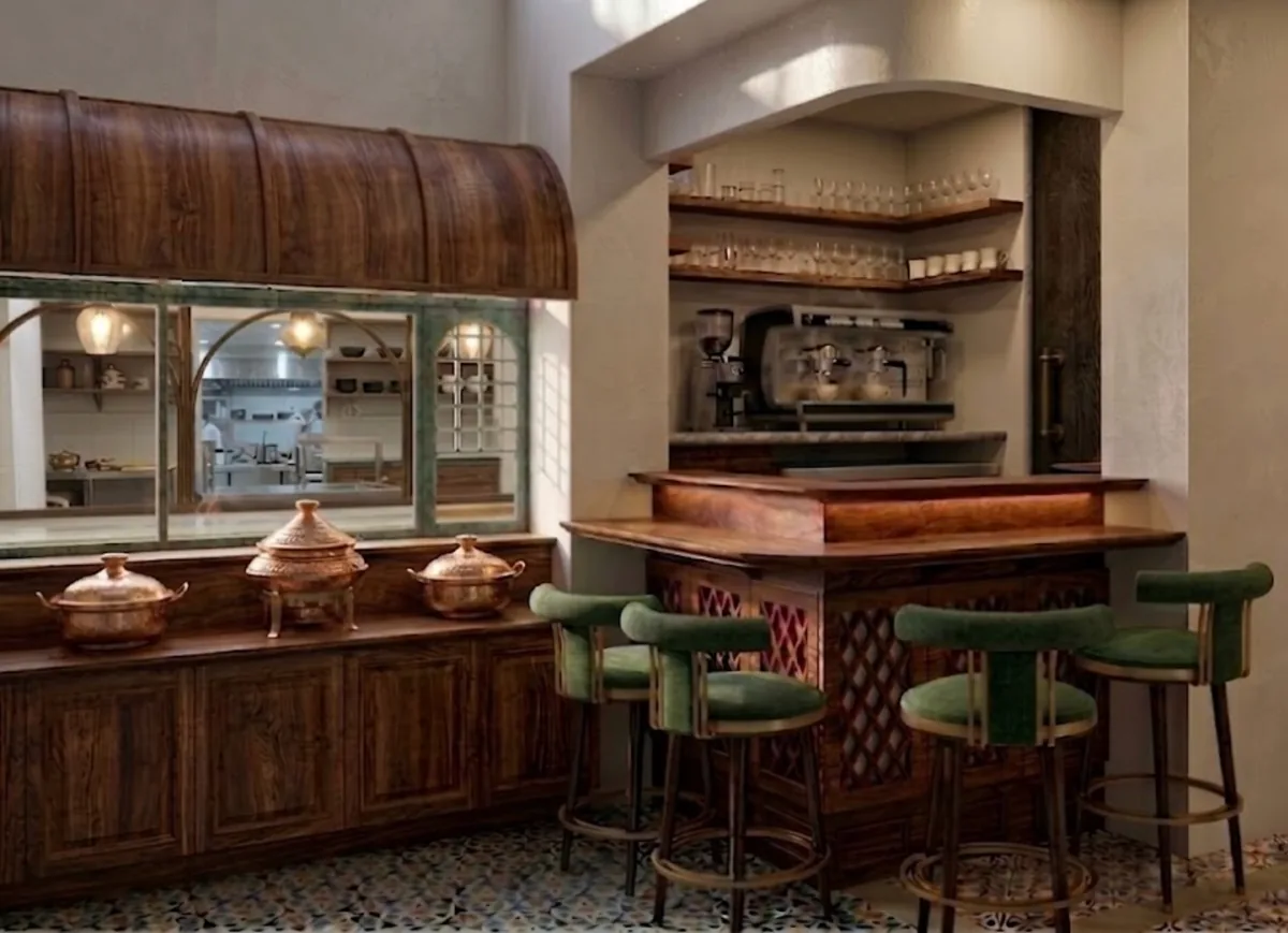 Buffet counter and coffee bar in the vegetarian dining room at La Maison Pondichéry, with copper serving dishes and mosaic floor